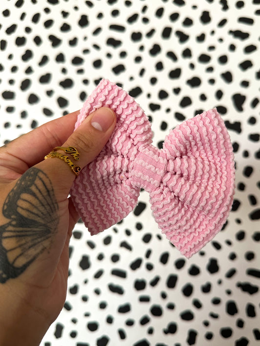light pink waved rib knit bows