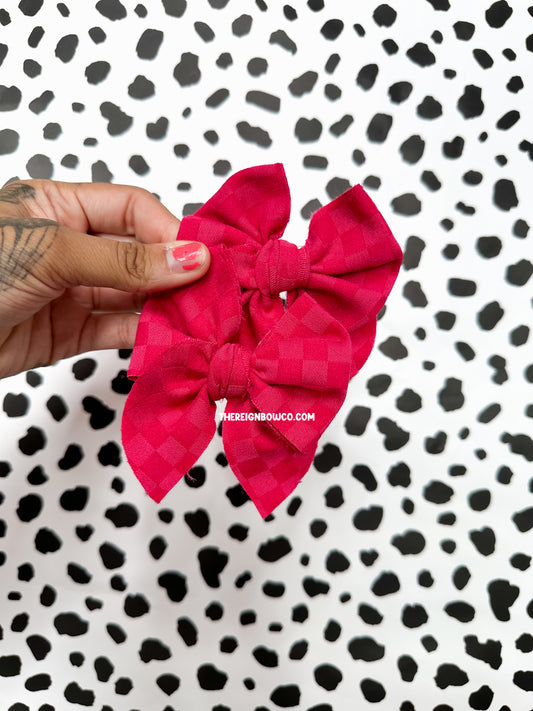 pink checkered knit bows